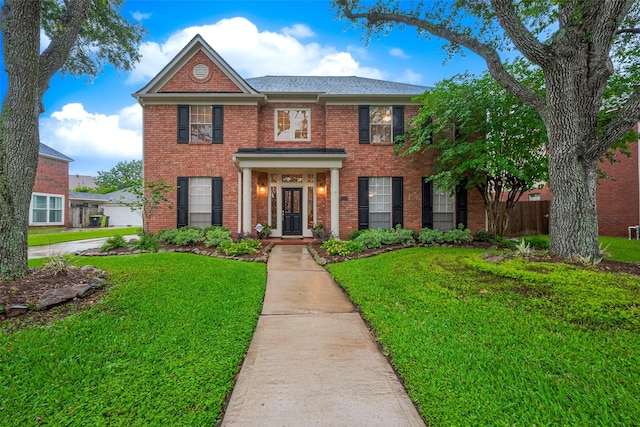 1842 Lake Winds, Missouri City, TX 77459 - colonial house with a front yard and brick siding