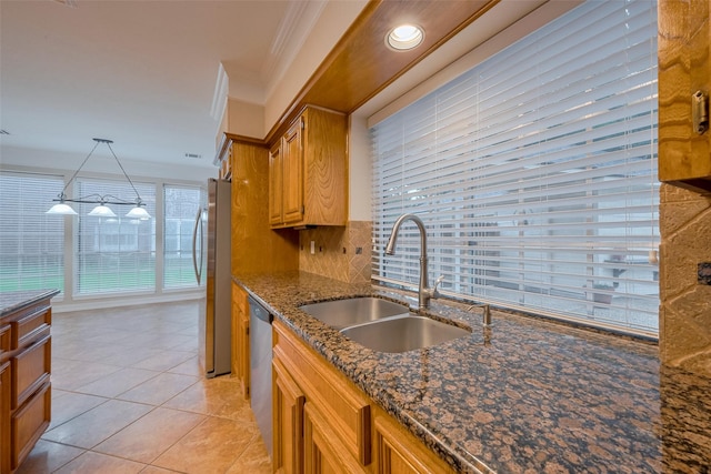 1842 Lake Winds, Missouri City, TX 77459 - kitchen featuring dark stone countertops, ornamental molding, a sink, light tile patterned flooring, and appliances with stainless steel finishes