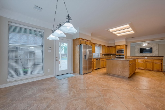 1842 Lake Winds, Missouri City, TX 77459 - kitchen with stainless steel appliances, visible vents, backsplash, and ornamental molding