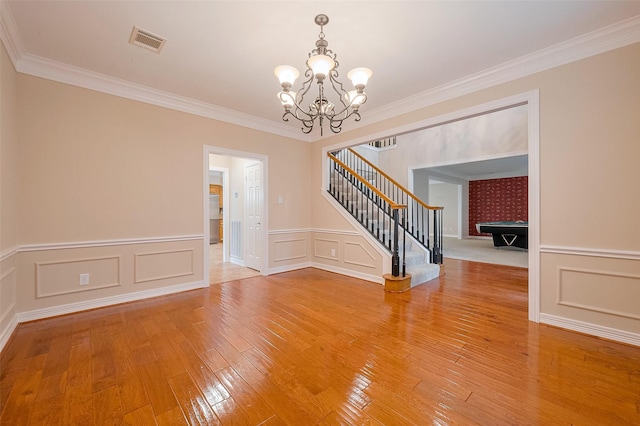 1842 Lake Winds, Missouri City, TX 77459 - interior space featuring visible vents, an inviting chandelier, light wood-style floors, stairs, and crown molding