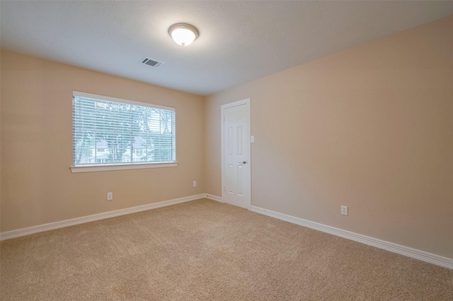 1842 Lake Winds, Missouri City, TX 77459 - empty room with baseboards, visible vents, and light carpet