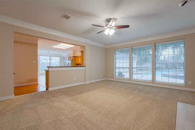 1842 Lake Winds, Missouri City, TX 77459 - unfurnished living room with a ceiling fan, crown molding, light colored carpet, baseboards, and visible vents