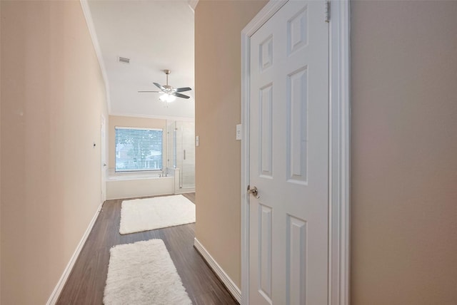 1842 Lake Winds, Missouri City, TX 77459 - hallway with dark wood-style floors, baseboards, crown molding, and visible vents