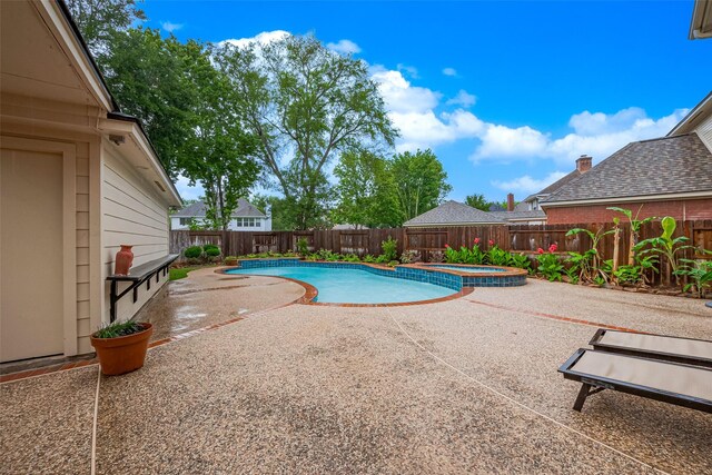 1842 Lake Winds, Missouri City, TX 77459 - view of pool featuring a pool with connected hot tub, a fenced backyard, and a patio area