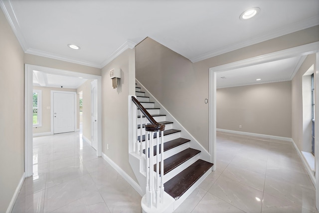 stairs with baseboards, ornamental molding, and recessed lighting