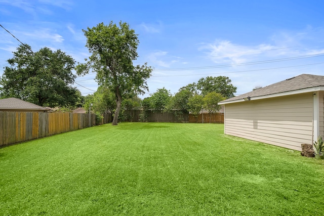 view of yard featuring a fenced backyard