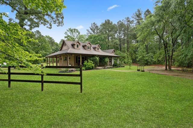 25672 Magnolia Pines Dr, Magnolia, TX 77355 - farmhouse-style home with covered porch and a front lawn