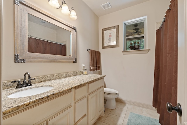 25672 Magnolia Pines Dr, Magnolia, TX 77355 - bathroom with toilet, vanity, tile patterned flooring, and baseboards