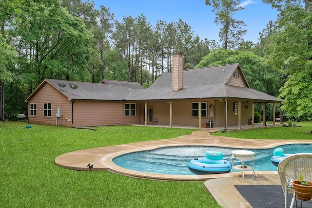 25672 Magnolia Pines Dr, Magnolia, TX 77355 - back of property with ceiling fan, a yard, and a patio area