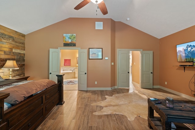25672 Magnolia Pines Dr, Magnolia, TX 77355 - bedroom with light wood-style floors, high vaulted ceiling, ensuite bathroom, baseboards, and a ceiling fan