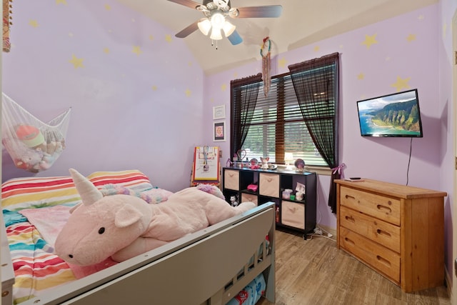25672 Magnolia Pines Dr, Magnolia, TX 77355 - bedroom featuring light wood-type flooring, lofted ceiling, and a ceiling fan