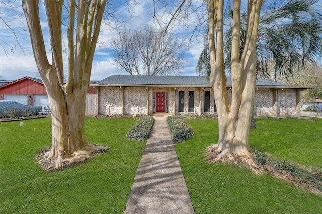 4004 Briarglen Dr, Dickinson, TX 77539 - view of front of house with brick siding, a front lawn, and a shingled roof