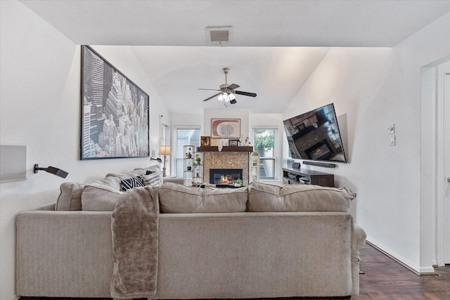 1201 Bering Dr Unit 28, Houston, TX 77057 - living area featuring dark wood finished floors, a glass covered fireplace, baseboards, visible vents, and ceiling fan