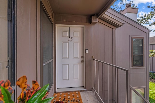 1201 Bering Dr Unit 28, Houston, TX 77057 - property entrance with a chimney