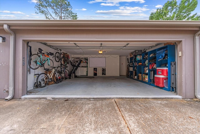1201 Bering Dr Unit 28, Houston, TX 77057 - garage with a garage door opener and driveway