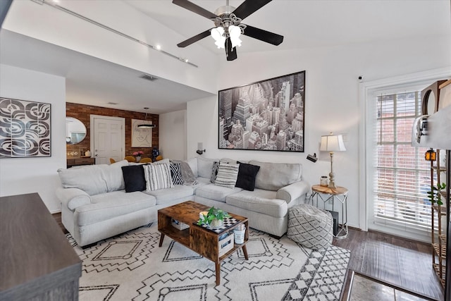 1201 Bering Dr Unit 28, Houston, TX 77057 - living room with lofted ceiling, wood finished floors, visible vents, and ceiling fan