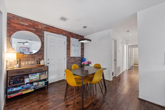 1201 Bering Dr Unit 28, Houston, TX 77057 - dining room with baseboards, a ceiling fan, wood finished floors, and visible vents