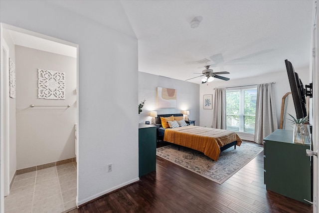 1201 Bering Dr Unit 28, Houston, TX 77057 - bedroom featuring a ceiling fan and wood finished floors