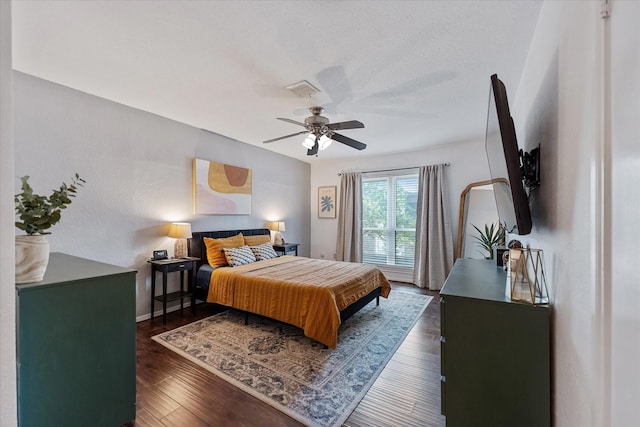1201 Bering Dr Unit 28, Houston, TX 77057 - bedroom with baseboards, a ceiling fan, and wood finished floors