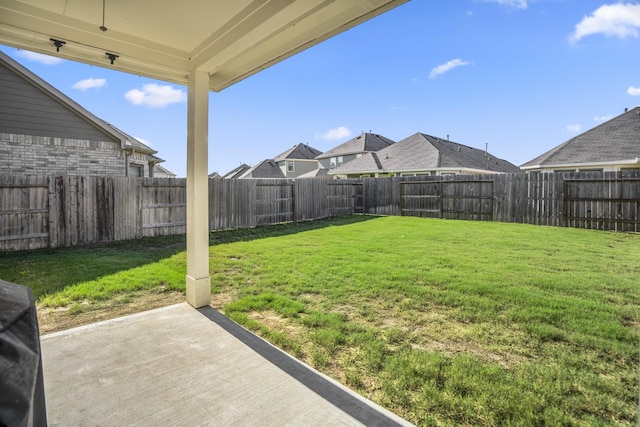 view of yard with a patio and a residential view