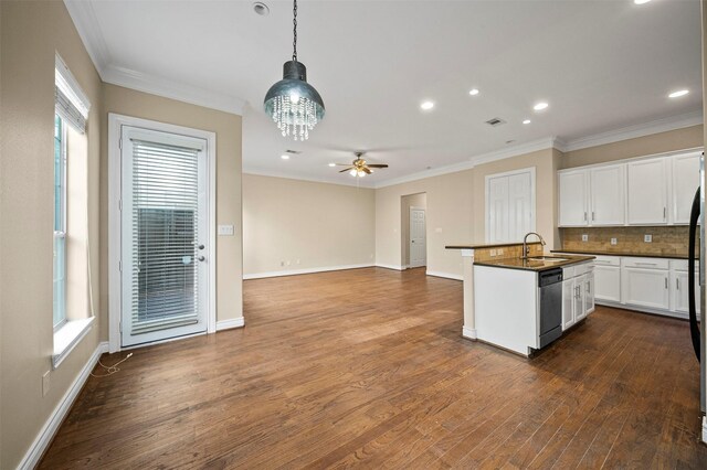 3444 Cline St, Houston, TX 77020 - kitchen featuring decorative backsplash, a wealth of natural light, dark countertops, and dishwashing machine