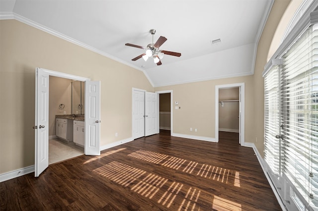 3444 Cline St, Houston, TX 77020 - unfurnished bedroom featuring vaulted ceiling, visible vents, dark wood-style flooring, and multiple windows