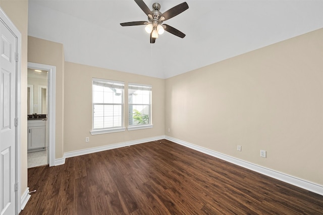 3444 Cline St, Houston, TX 77020 - unfurnished bedroom featuring dark wood-type flooring, vaulted ceiling, a ceiling fan, and baseboards