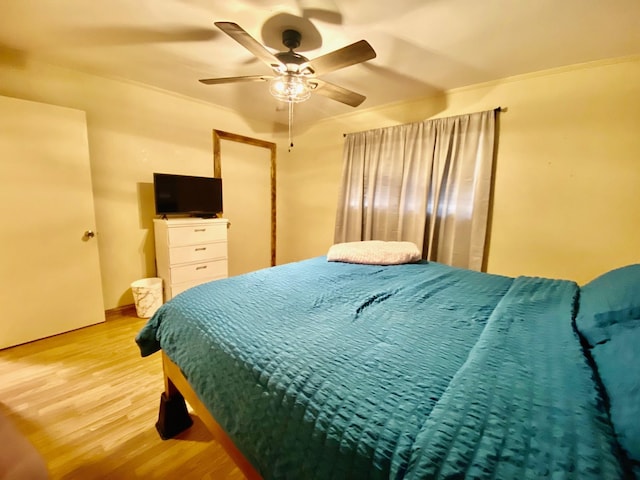 bedroom featuring ceiling fan and light wood-style flooring