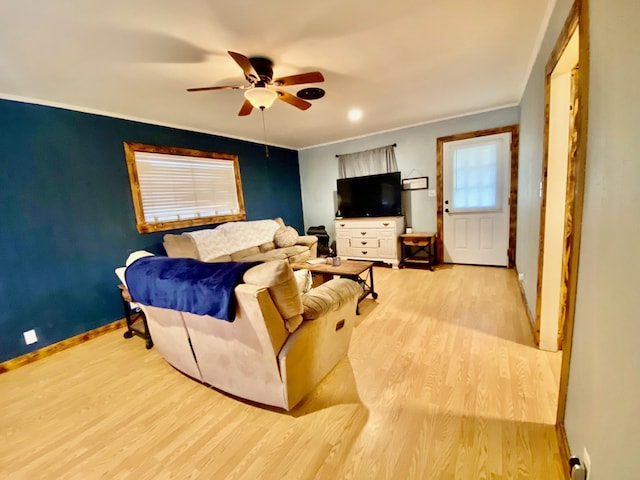 bedroom with ceiling fan, baseboards, crown molding, and light wood-type flooring