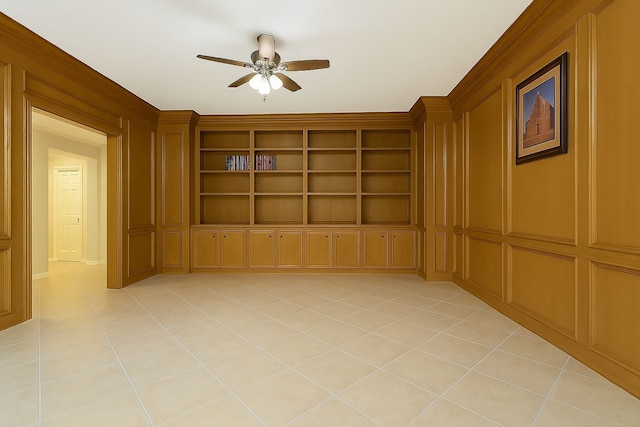 spare room with ceiling fan and light tile patterned floors