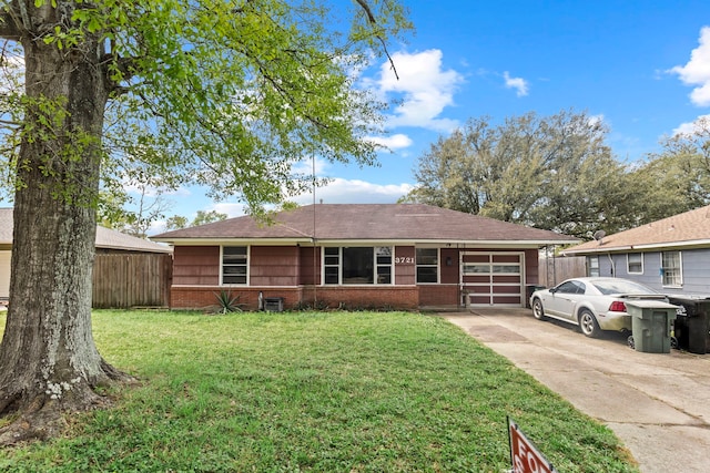 3721 Avalon Ave, Port Arthur, TX 77642 - ranch-style house with a front lawn, driveway, an attached garage, fence, and brick siding