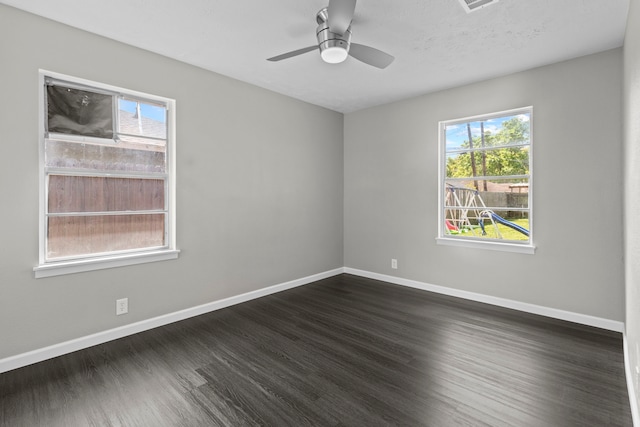3721 Avalon Ave, Port Arthur, TX 77642 - spare room featuring baseboards, a wealth of natural light, and dark wood-style floors