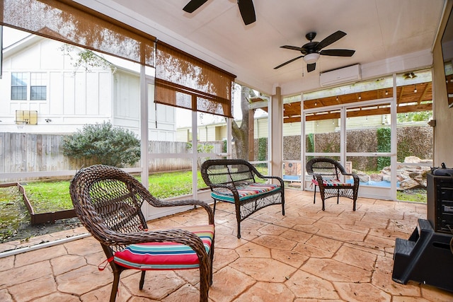 sunroom featuring a ceiling fan, an AC wall unit, and an outdoor living space