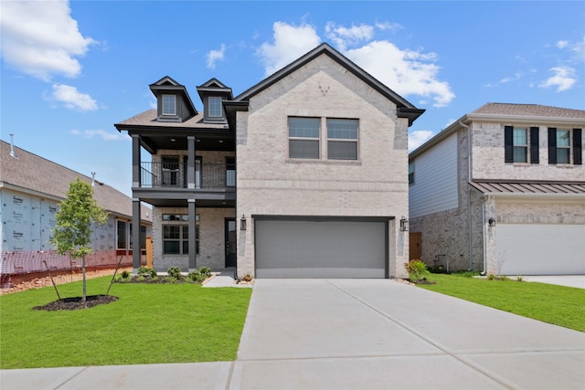 3220 Bello Green Ln, Katy, TX 77493 - view of front of property featuring brick siding, a balcony, a front yard, an attached garage, and driveway