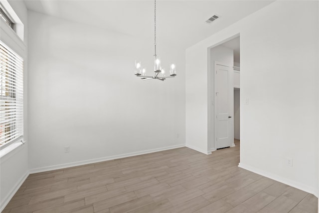 3220 Bello Green Ln, Katy, TX 77493 - unfurnished room with a chandelier, light wood-type flooring, and baseboards