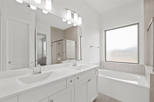 3220 Bello Green Ln, Katy, TX 77493 - bathroom featuring a garden tub, a stall shower, and double vanity