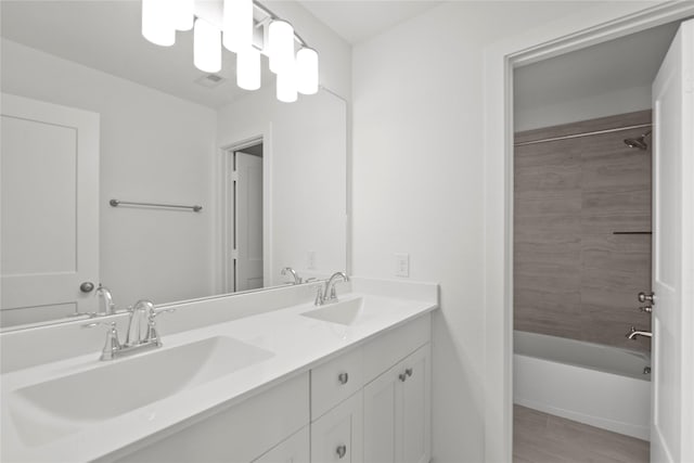 3220 Bello Green Ln, Katy, TX 77493 - full bath featuring double vanity, shower / bath combination, and wood finished floors