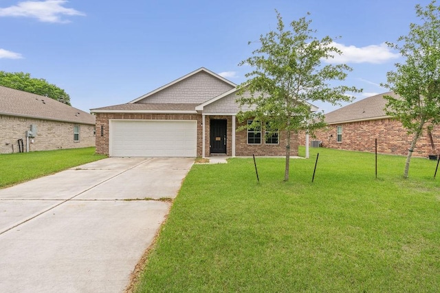 ranch-style house with an attached garage, driveway, brick siding, and a front yard