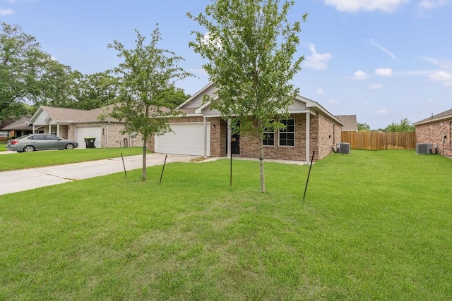 view of front facade with a garage, cooling unit, concrete driveway, and fence