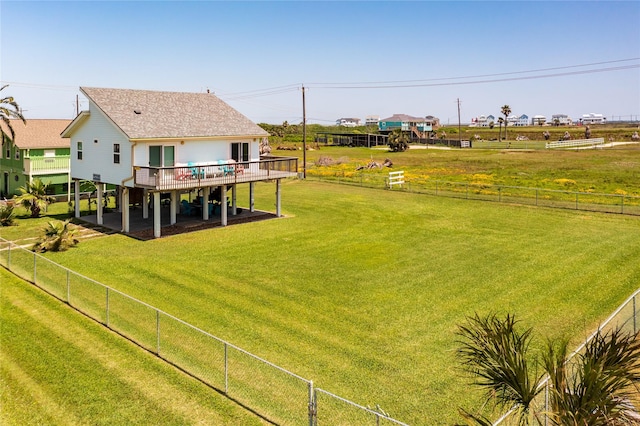 4215 San Jacinto Dr, Galveston, TX 77554 - back of property featuring a wooden deck and a shingled roof