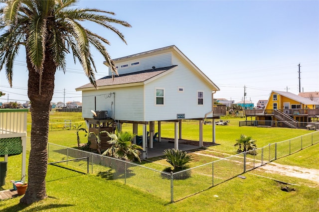 4215 San Jacinto Dr, Galveston, TX 77554 - back of house featuring roof with shingles