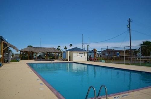 4215 San Jacinto Dr, Galveston, TX 77554 - community pool with a patio