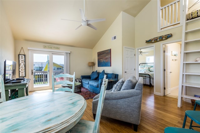 4215 San Jacinto Dr, Galveston, TX 77554 - living room featuring a ceiling fan, high vaulted ceiling, wood finished floors, and baseboards