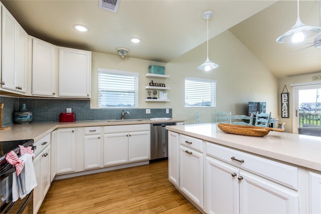 4215 San Jacinto Dr, Galveston, TX 77554 - kitchen with stainless steel dishwasher, a sink, light countertops, range, and backsplash