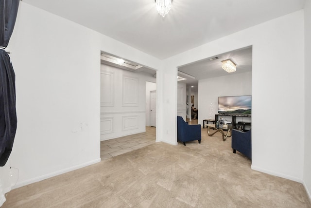 interior space featuring baseboards and tile patterned floors