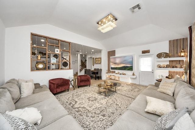 living room featuring lofted ceiling, visible vents, and radiator
