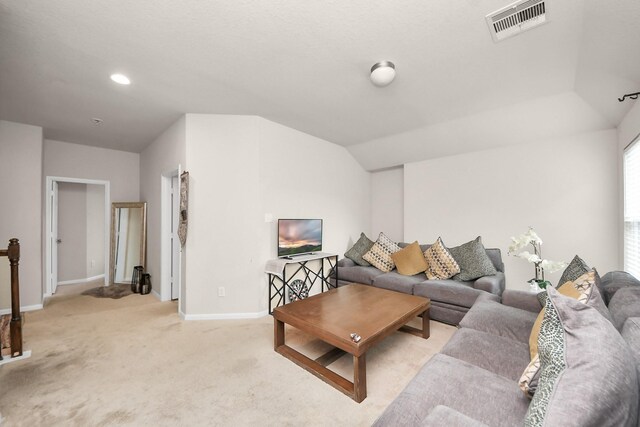 living area featuring light carpet, baseboards, lofted ceiling, visible vents, and recessed lighting