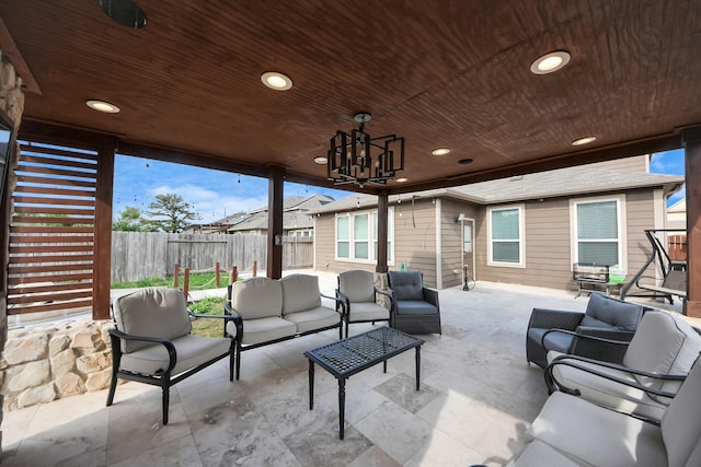 view of patio featuring an outdoor living space and a fenced backyard