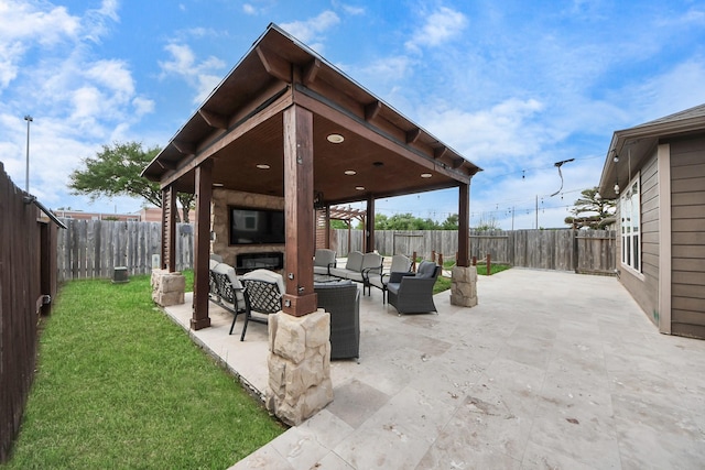 view of patio / terrace featuring an outdoor living space, a fenced backyard, and a gazebo