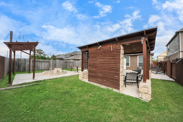 back of house featuring a fenced backyard, a patio area, and a lawn